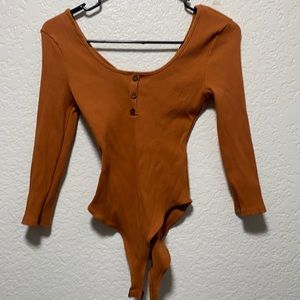 Burnt orange stretchy body suit